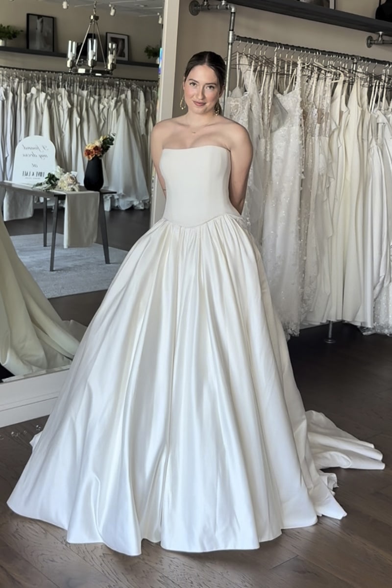 Custom Vagabond Bridal wedding dress featuring Mia stretch crepe corset with a basque waist silhouette paired with the luxurious Kai satin skirt - available at Love and Lace Bridal OC.