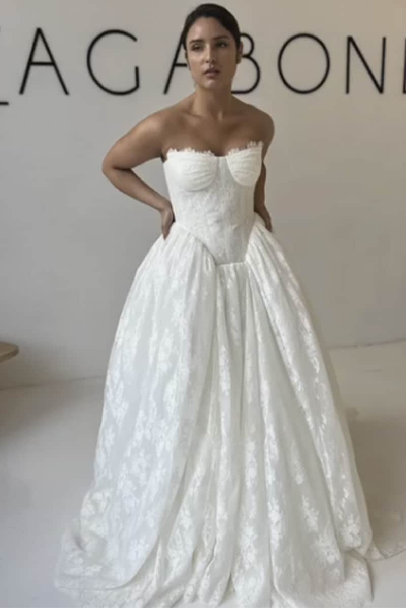 Kris wedding gown by Vagabond Bridal featuring Rococo-inspired square basque waist, heavily boned corset with Chantilly lace trim, and voluminous box pleat skirt - available at Love and Lace Bridal OC.