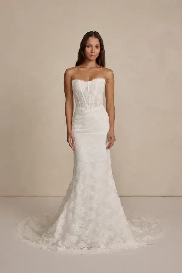 Romy by MWL Bride: A romantic 3D floral lace wedding dress with a plunging neckline, low back, and a figure-hugging fit-and-flare silhouette at Love and Lace Bridal Salon in Orange CA
