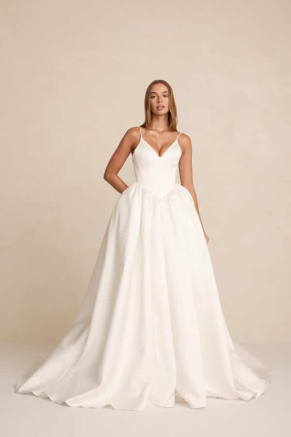 Lake by MWL Bride (formerly Made With Love Bridal) at Love and Lace Bridal Salon in Orange, CA: a modern basque waist and satin princess silhouette wedding dress
