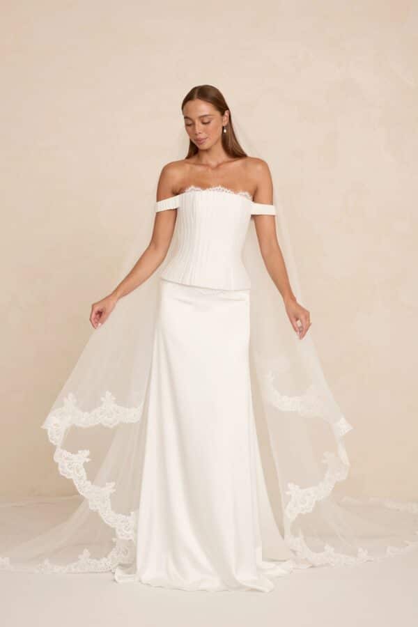 Duke wedding dress by MWL Bride (Made With Love Bridal) with optional off-the-shoulder straps and smooth skirt with a veil available at Love and Lace Bridal Salon in Orange, CA.