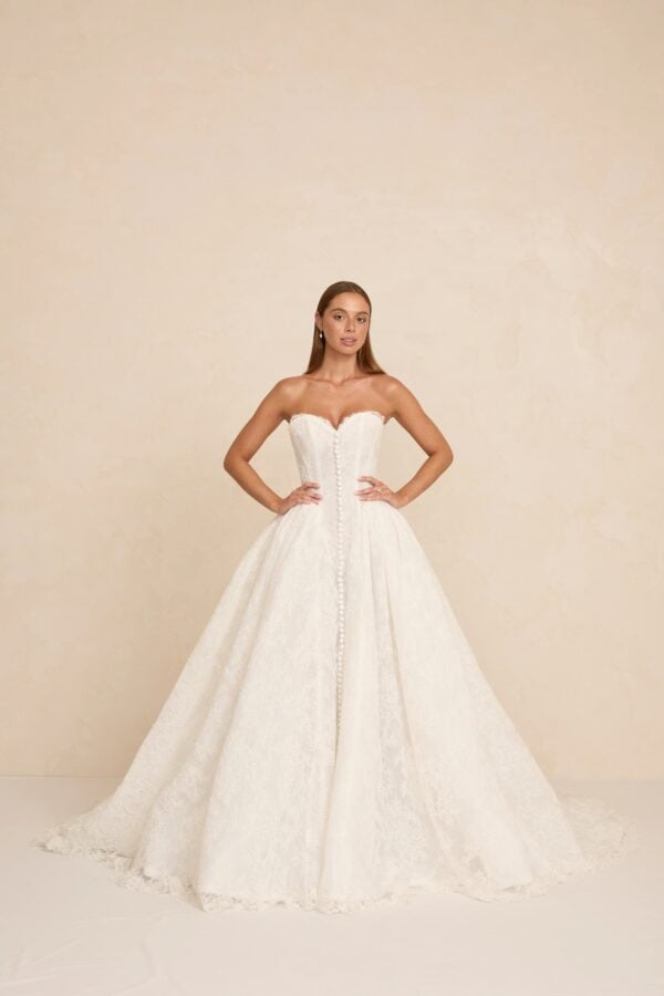 Rue wedding dress by MWL Bride featuring a modern basque waist (A-line silhouette) with a sweetheart neckline, structured boning in Chantilly lace, available at Love and Lace Bridal Salon in Orange, CA.