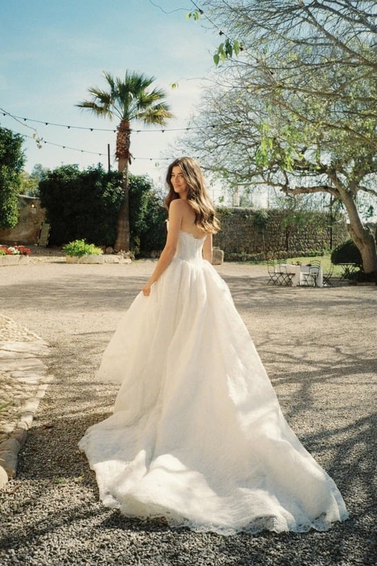 Rue wedding dress by MWL Bride featuring a modern basque waist (A-line silhouette) with a sweetheart neckline, structured boning in Chantilly lace, available at Love and Lace Bridal Salon in Orange, CA.
