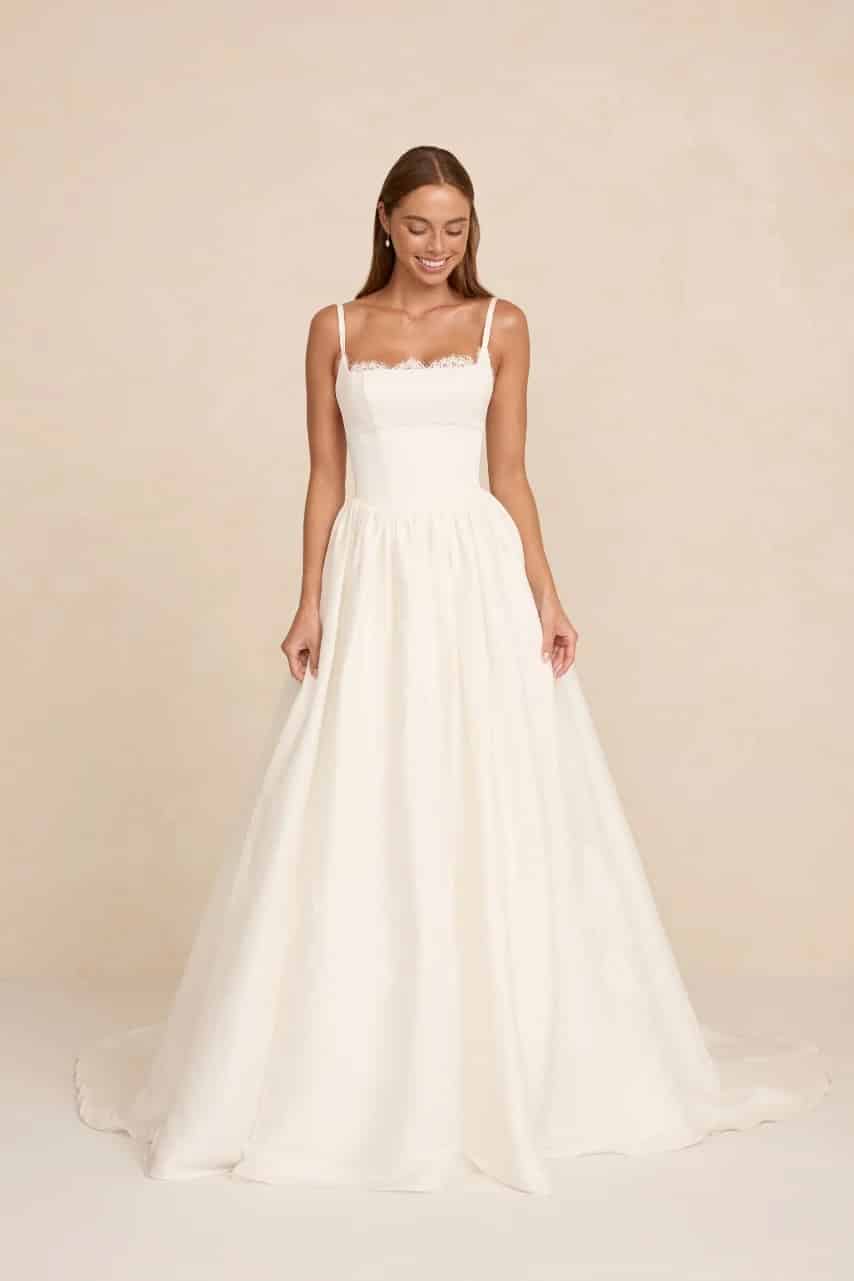 Adeline wedding dress by MWL Bride (Made with Love Bridal) in Mikado and silk linen featuring a structured Prim lace bodice and flowing skirt at Love and Lace Bridal Salon in Orange, CA.